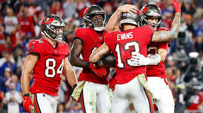 Nov 22, 2021; Tampa, Florida, USA; Tampa Bay Buccaneers quarterback Tom Brady (12) congratulates wide receiver Mike Evans (13) after scoring a touchdown in the second half against the New York Giants at Raymond James Stadium.